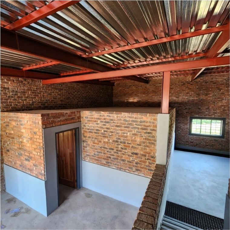 Steel structure and face brick with the roof sheeted over