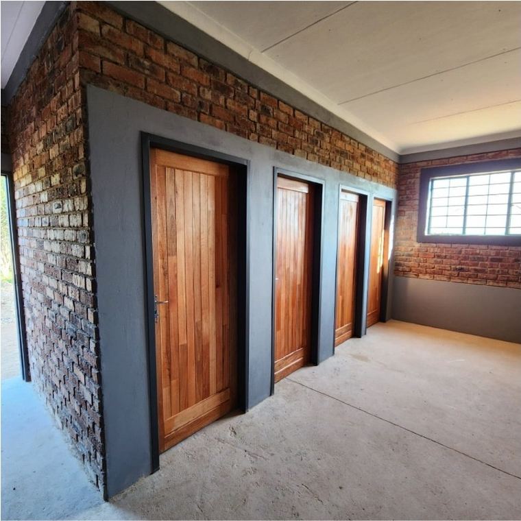 Timber doors hung and framed in face brick