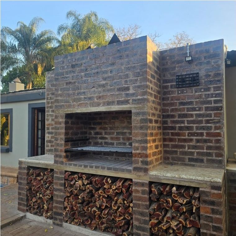 Brick braai with a wood store built in under the hearth